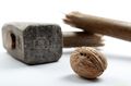 17745409-walnut-with-sledge-hammer-on-light-background.jpg